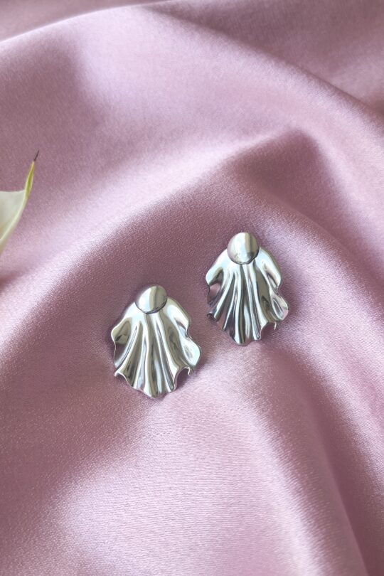 Close-up of silver drape statement earrings with detachable design, made from stainless steel for a tarnish-free shine.