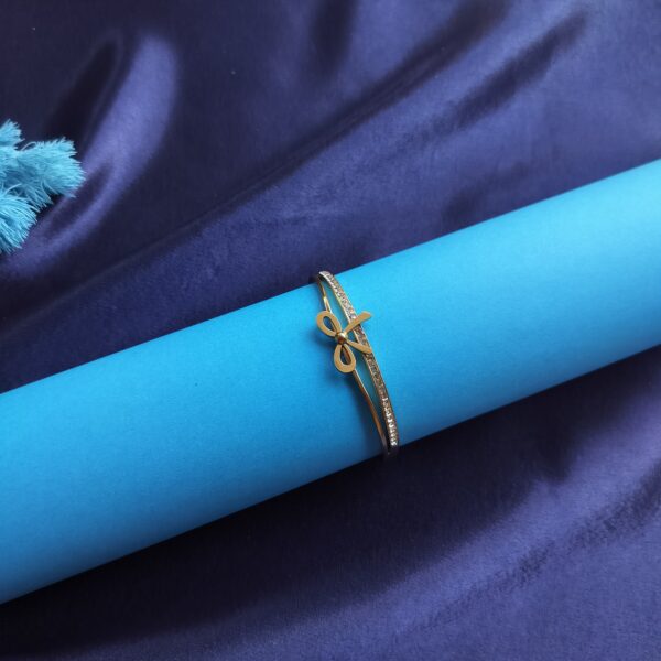 Delicate Gold Bow Bracelet front view with crystal details