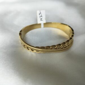 Close-up of intricate filigree style gold bracelet