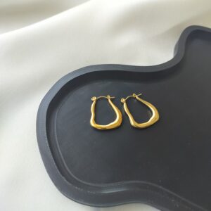 Gold modern wavy hoop earrings for women – artistic fluid design with anti-tarnish finish | Nitara Haute