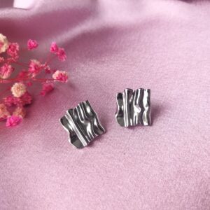 Front view of Raaga Wave Stud Earrings showing wave pattern