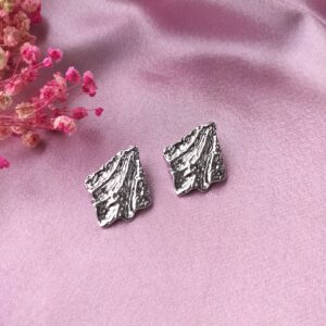 Front view of Silver Liquid Foil Studs earrings with metallic shine