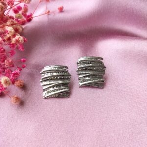 Silver Raaga Wave Studs front view showing elegant wave pattern