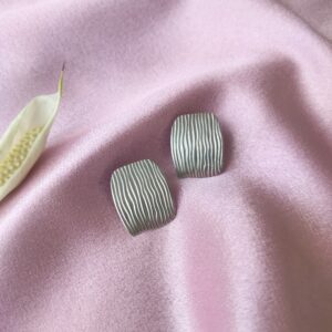 Front view of Silver Ripple Matte Studs showing vertical ripple texture