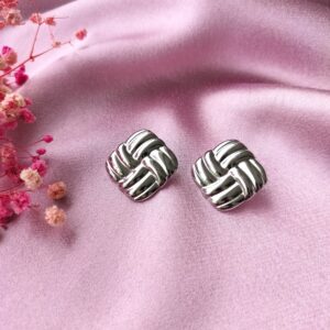 Silver Twilight Knot Studs front view – elegant rhodium-plated knot earrings