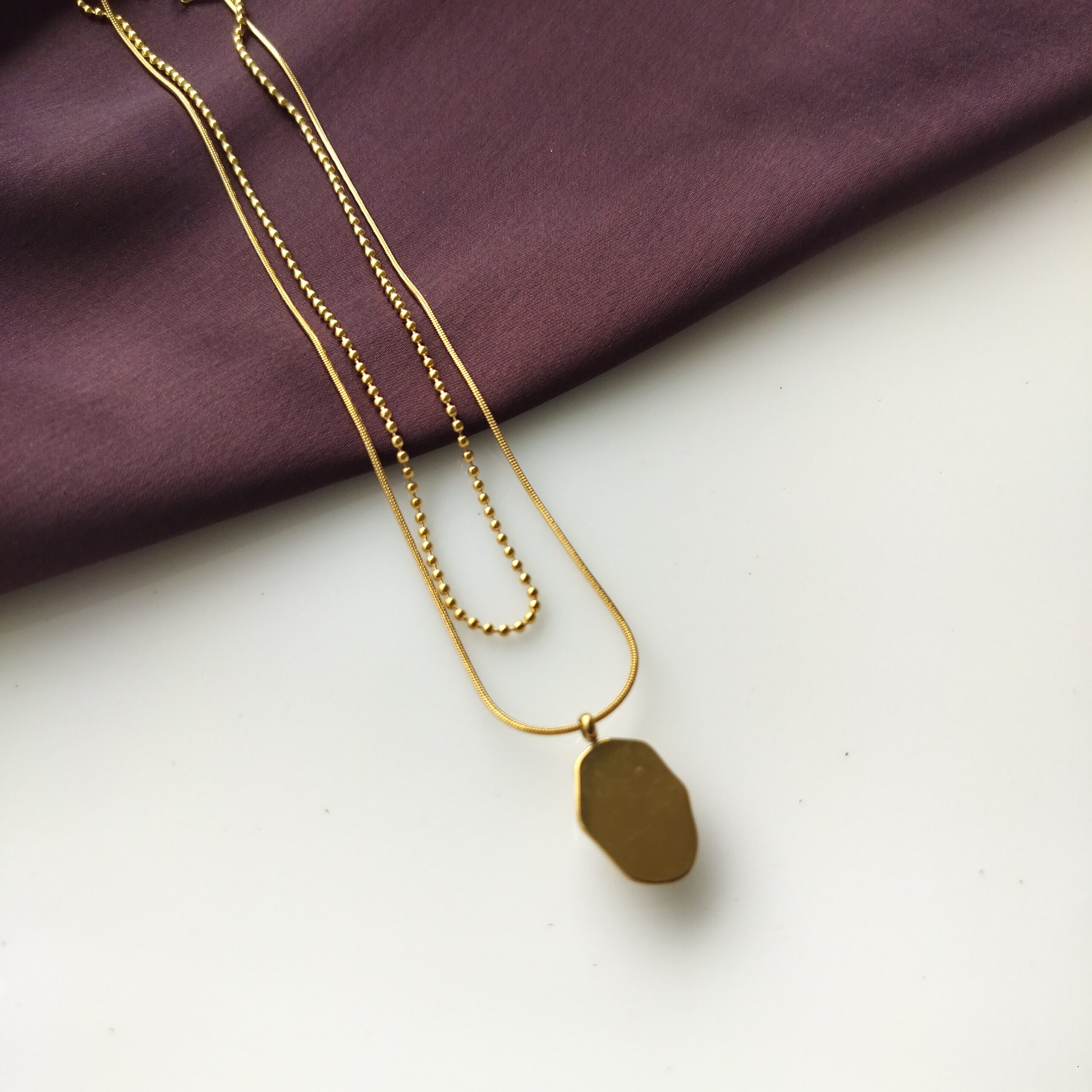Back view of the double layered pendant necklace clasp.