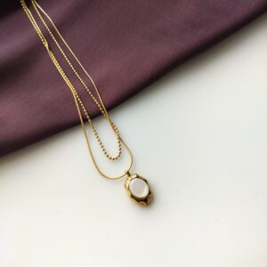 Front view of the Amber Luxe double layered pendant necklace.