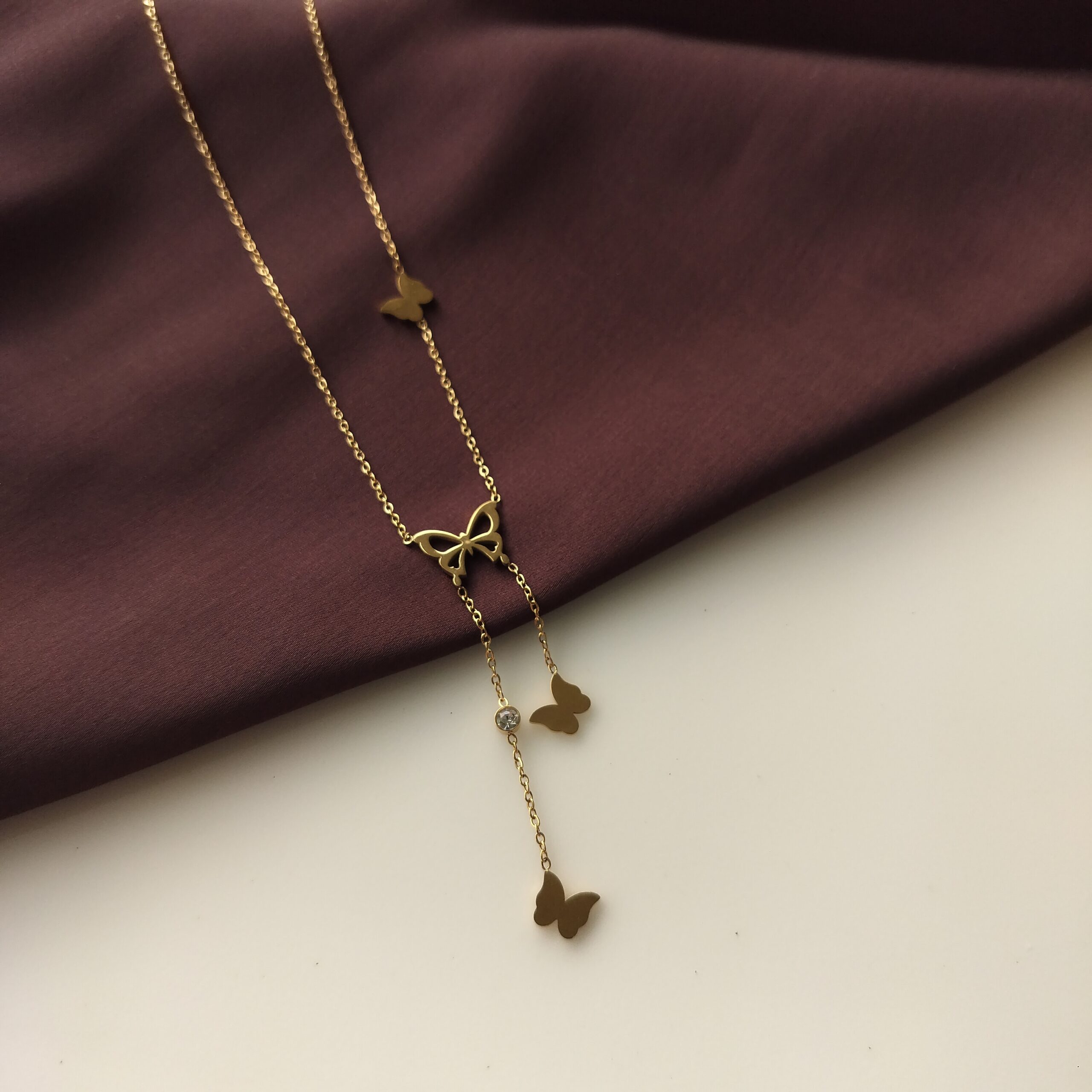 Butterfly Kisses necklace with main pendant and two hanging charms