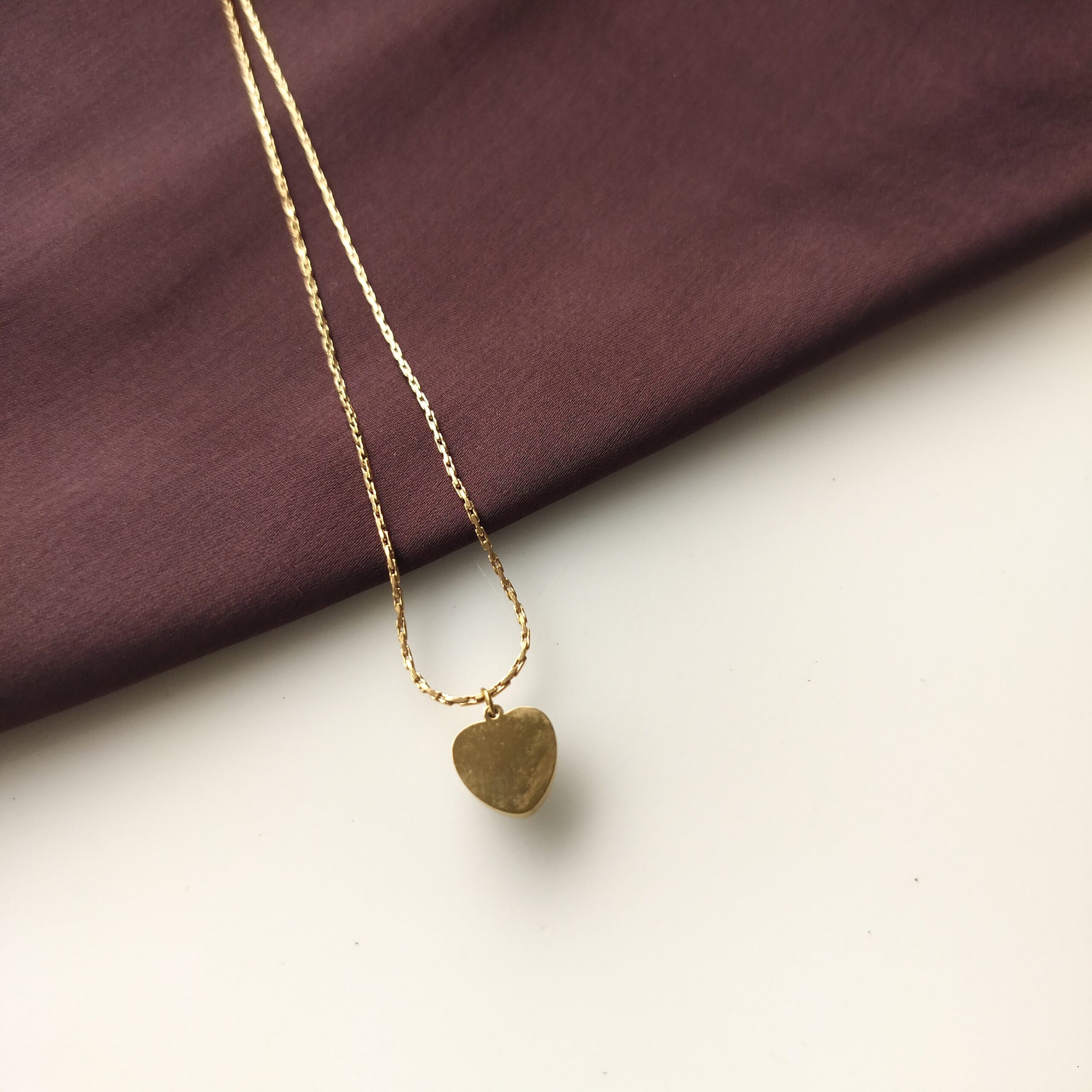 Back and side view of the pearl heart pendant