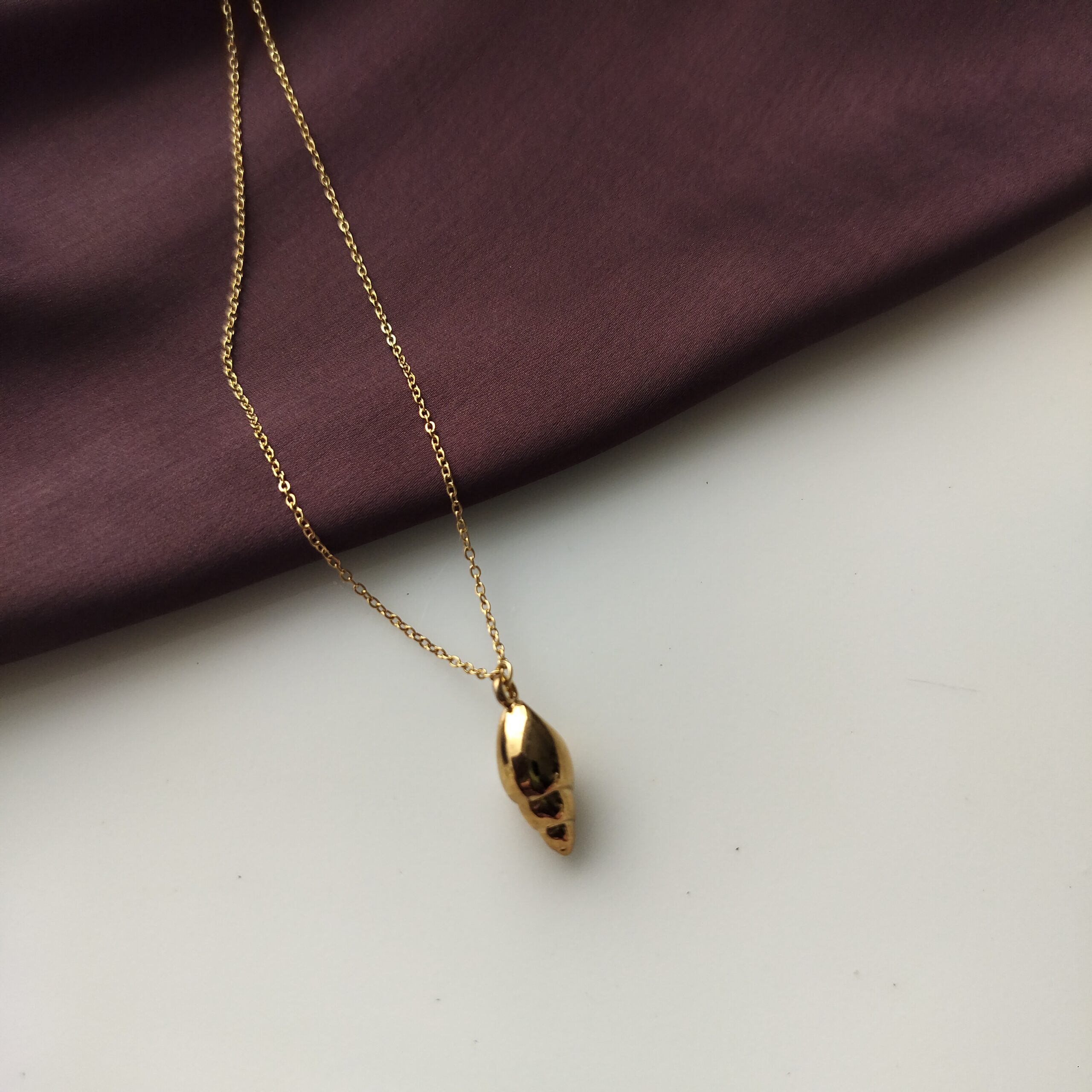 Back of the gold plated conch shell pendant
