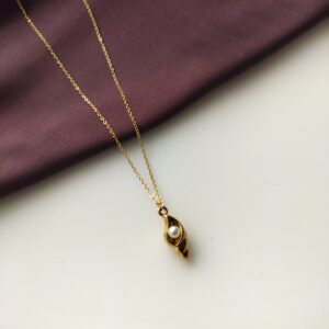 Golden Conch Pearl Pendant Necklace laying flat