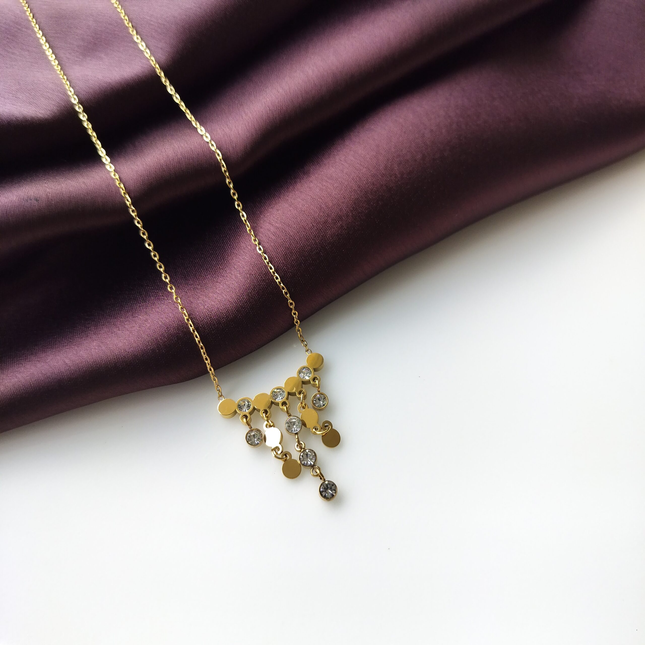 Golden Luxe Rainfall Necklace front view showing the cascading pendant strings.