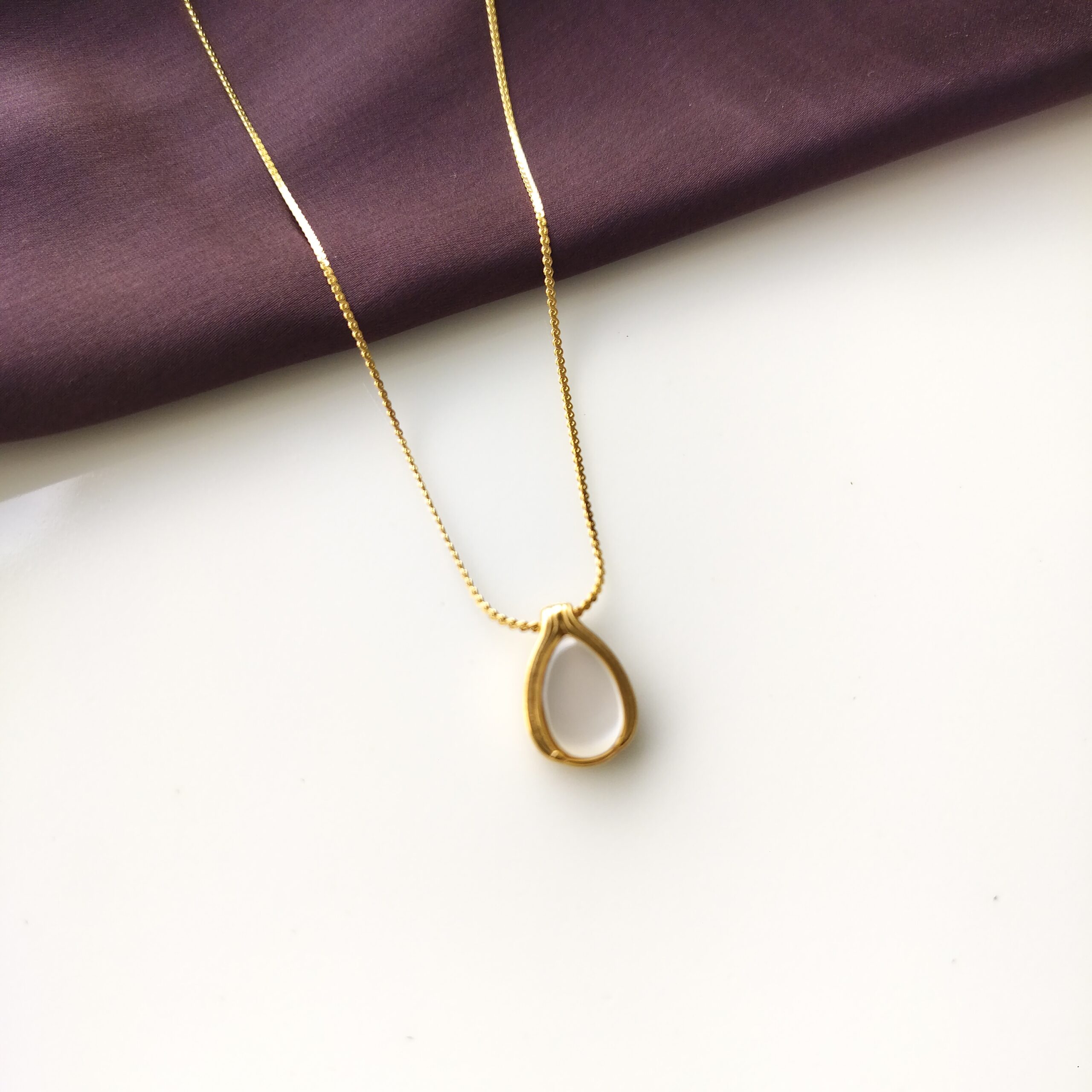 Close up detail of the genuine moonstone in the teardrop pendant.