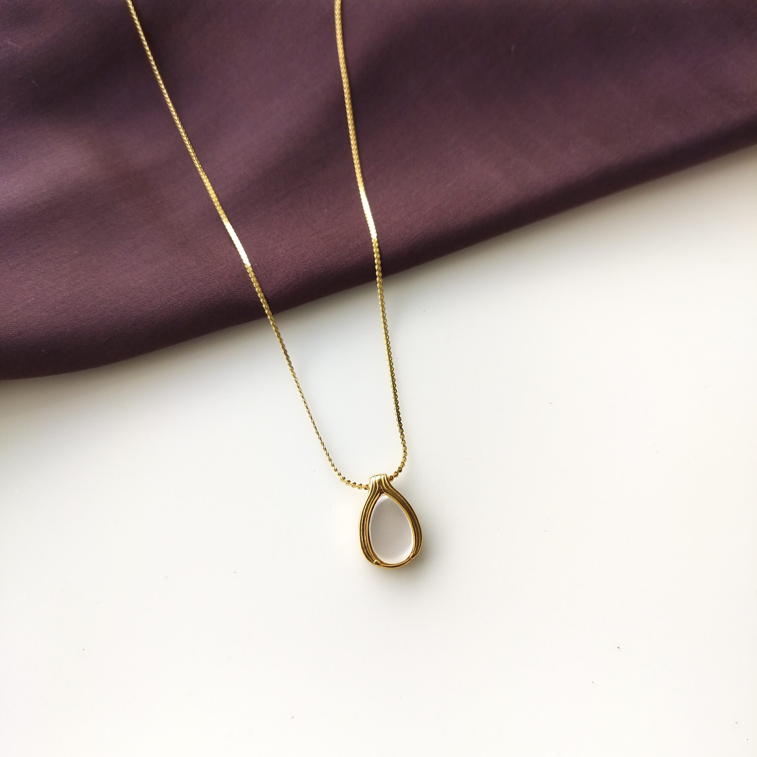 Gold plated Moonlit Teardrop Pendant necklace with moonstone from the front.