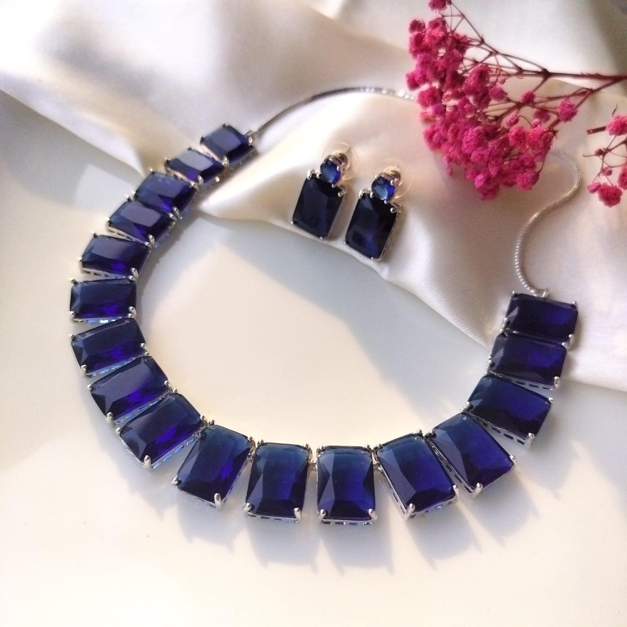 Close up detail of sapphire blue stones on choker necklace