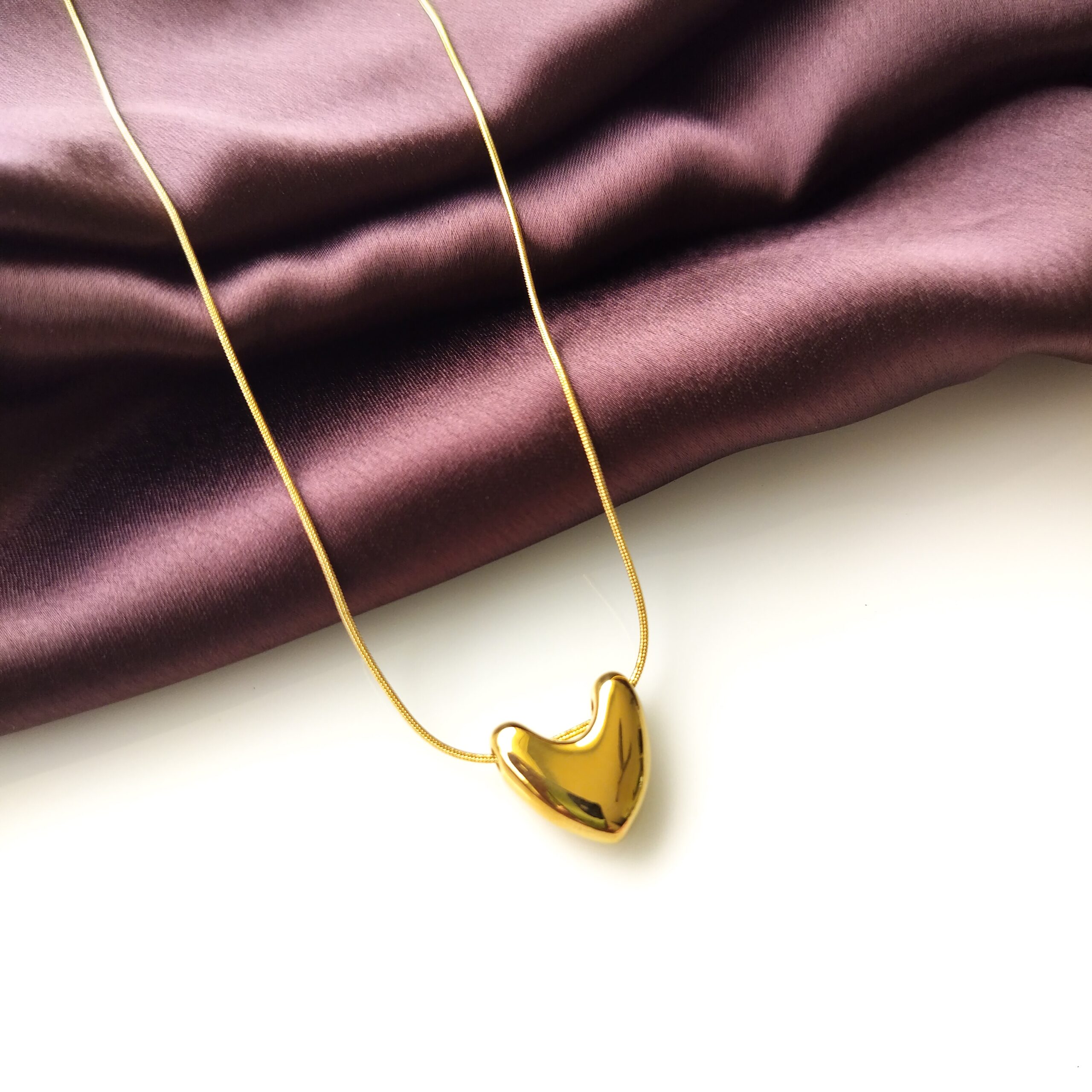 Solid Heart Pendant Necklace front view on display