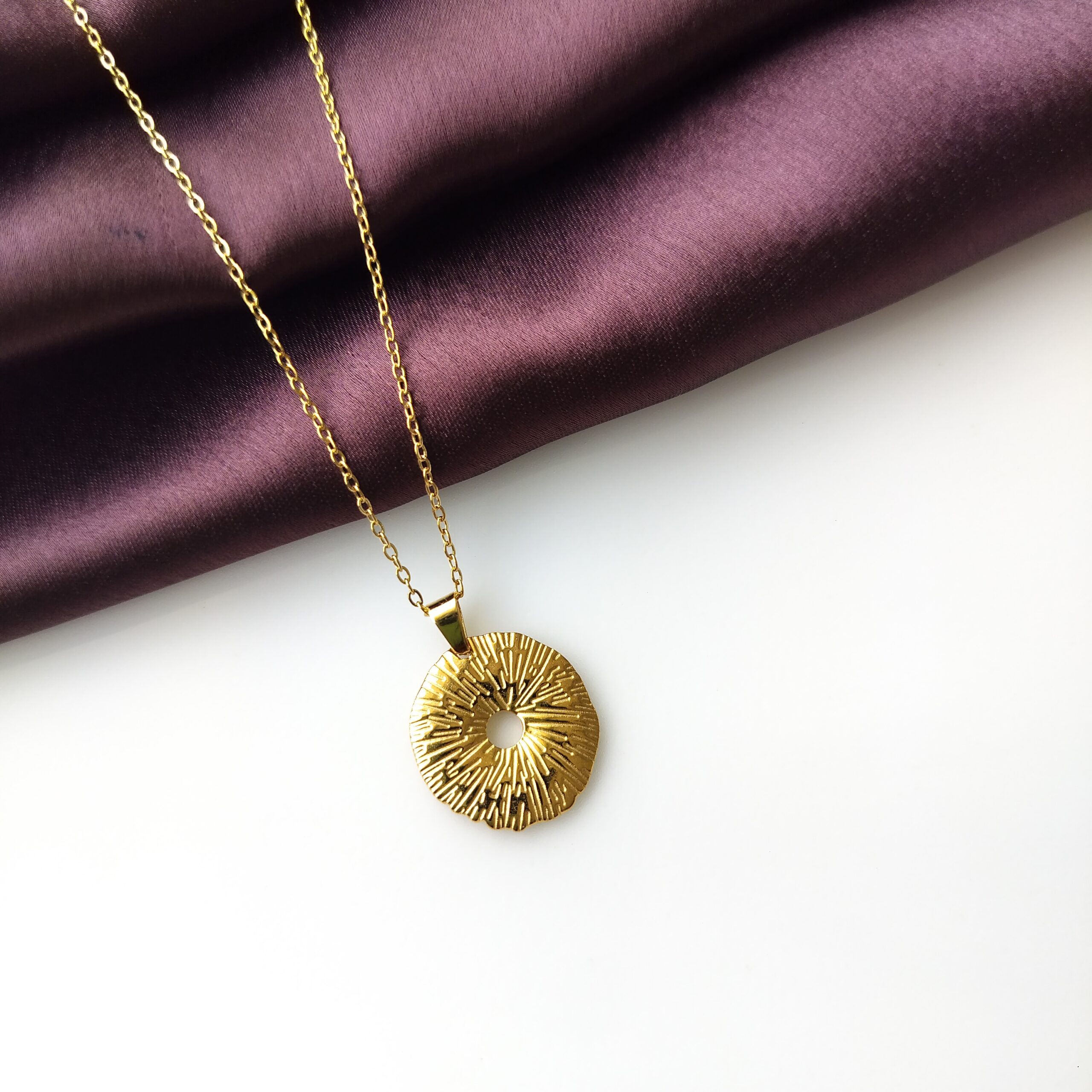 Close up of the textured surface on wide ring pendant